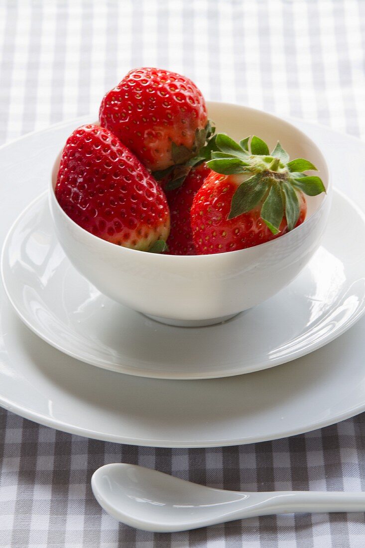 Strawberries in a porcelain teacup