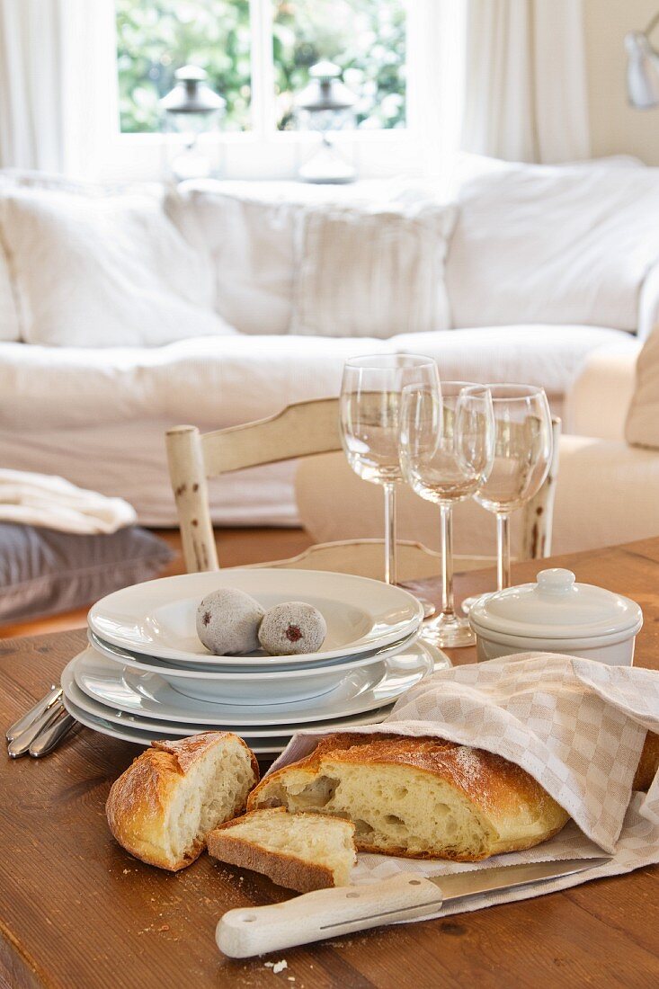 Fresh bread wrapped in a tea towel