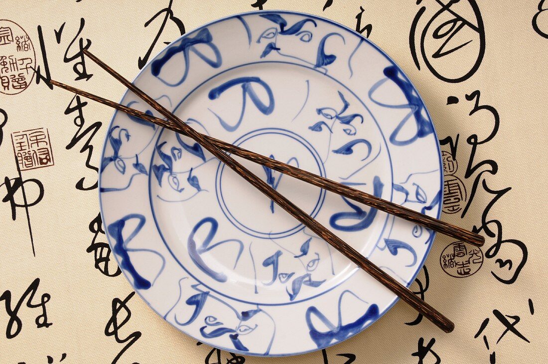 An Asian plate and chopsticks (view from above)