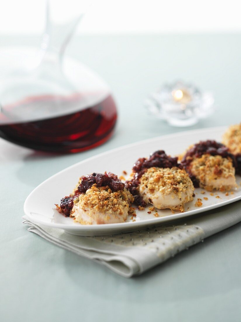 Oven-baked chicken breast topped with Stilton breadcrumbs and cranberries