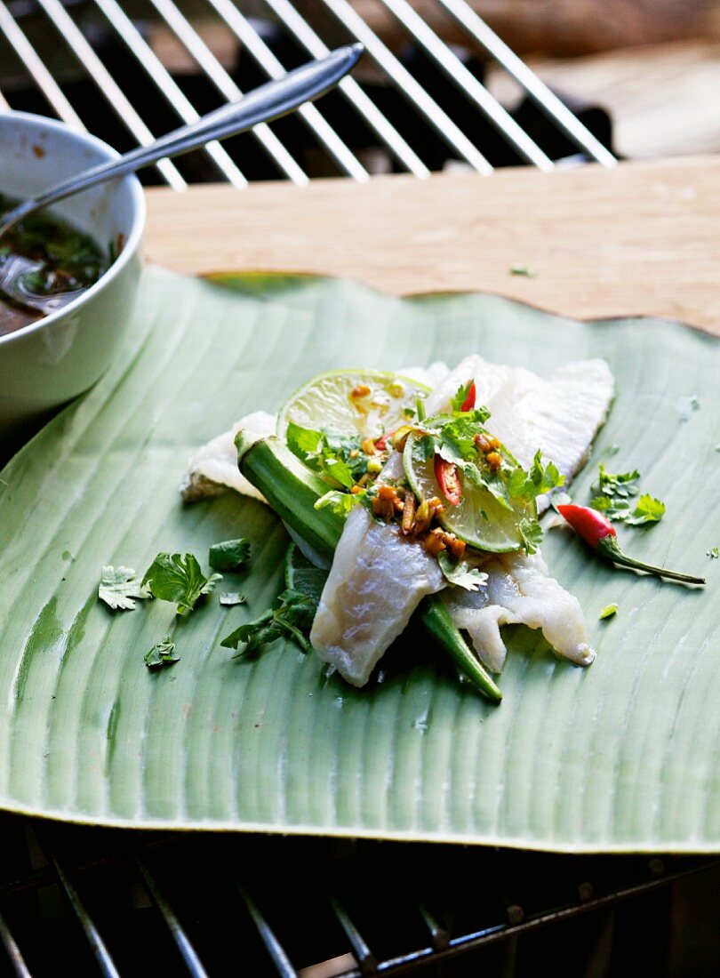 Fish with Asian marinade on a banana leaf