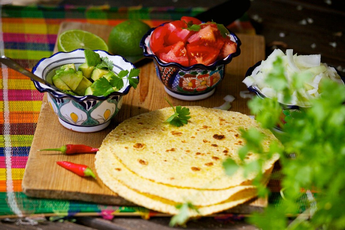 Tortillas, avocado, tomatoes and onions