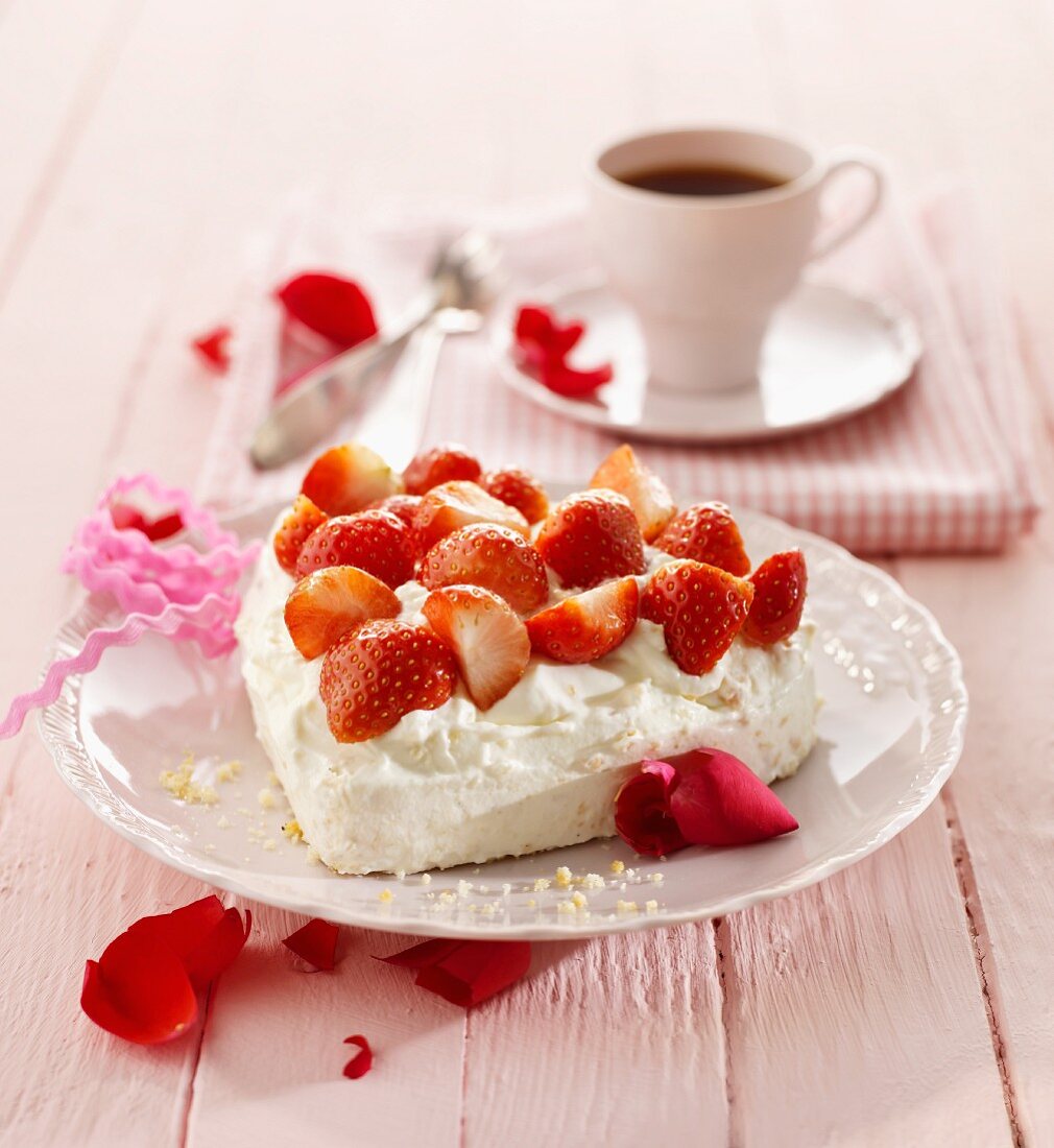 A heart-shaped meringue topped with strawberries