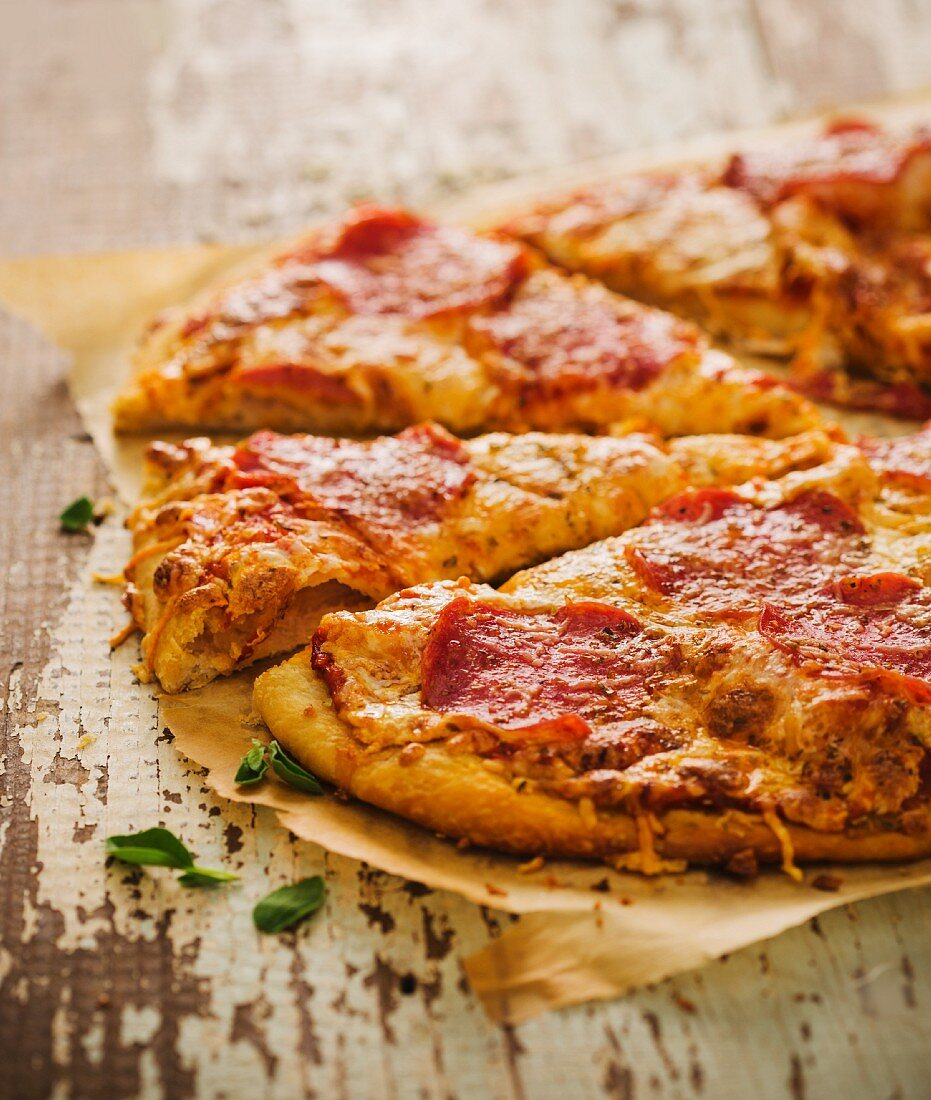 Sliced Pepperoni Pizza on Parchment Paper