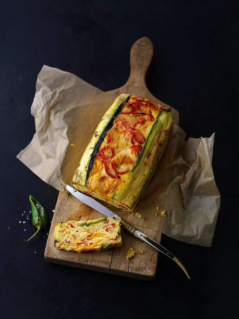Tapas cake with courgette on a chopping board