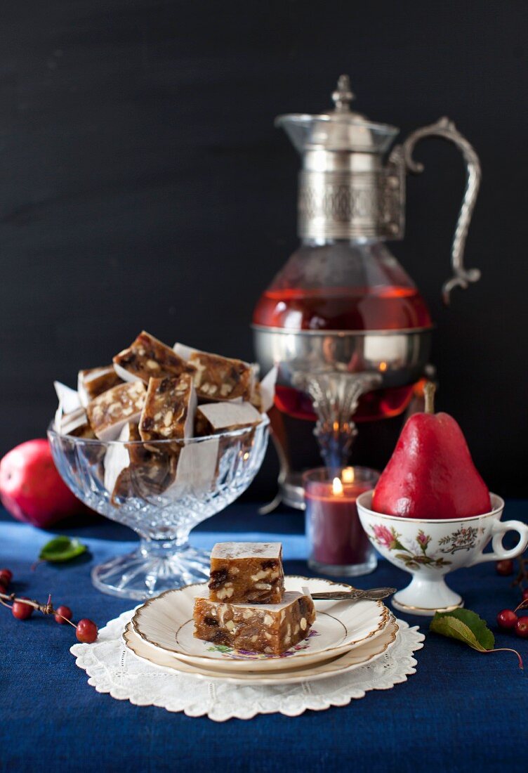 Panforte Squares with a Pear and Candle