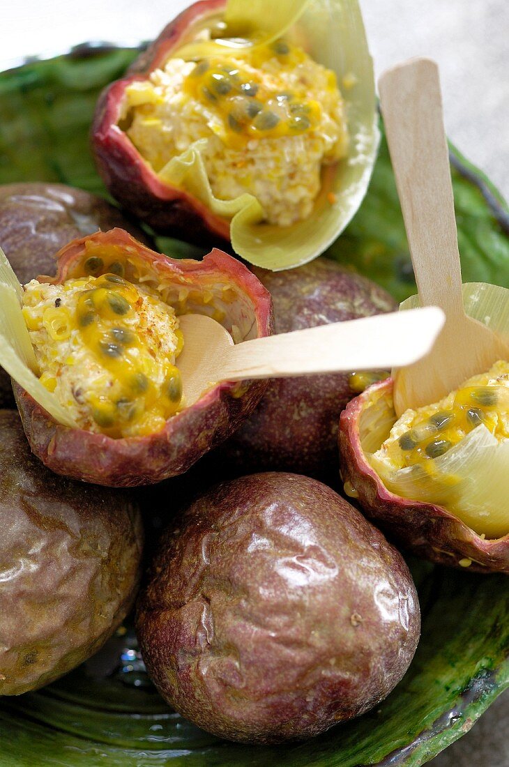 Prawn and mascarpone balls with passion fruit, inside passion fruit skins