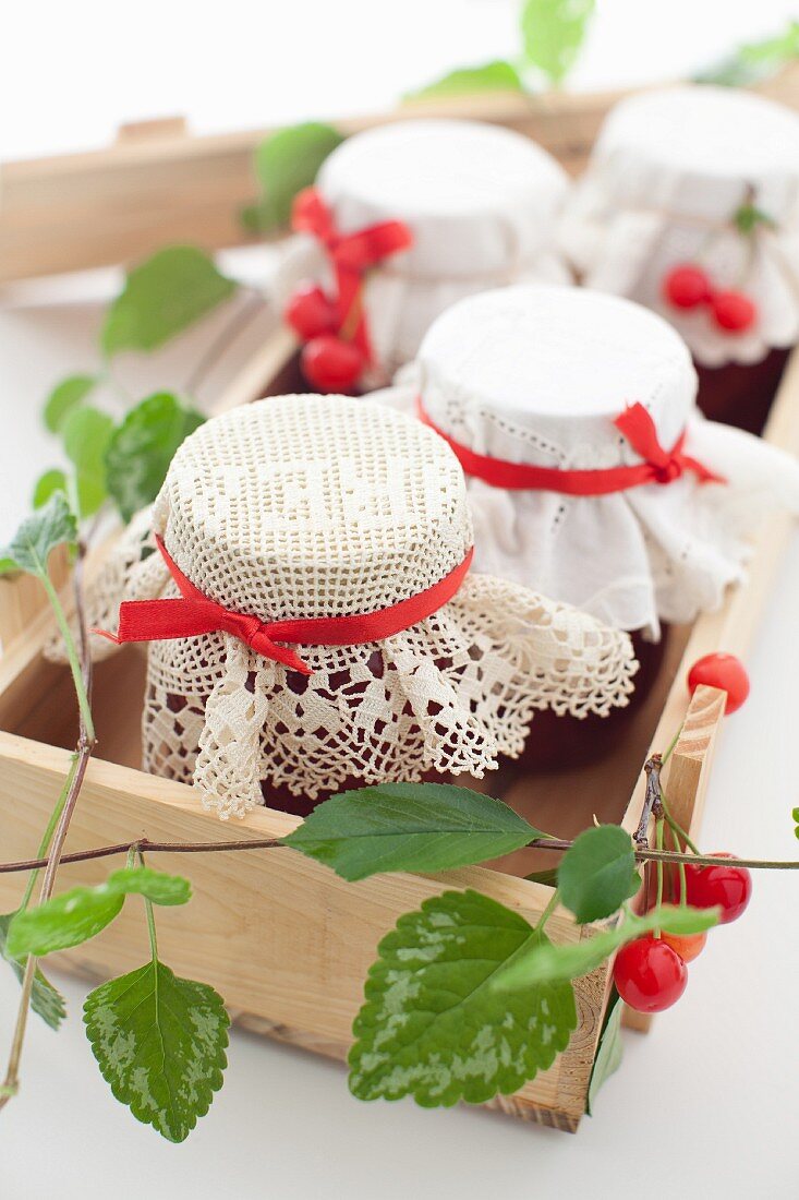 Jars of Homemade Cherry Jam in a Box