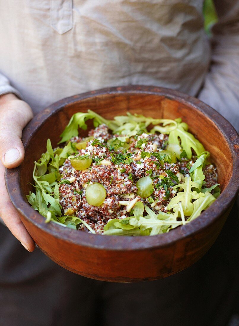 Quinoa salad with feta, rocket, grapes and pine nuts
