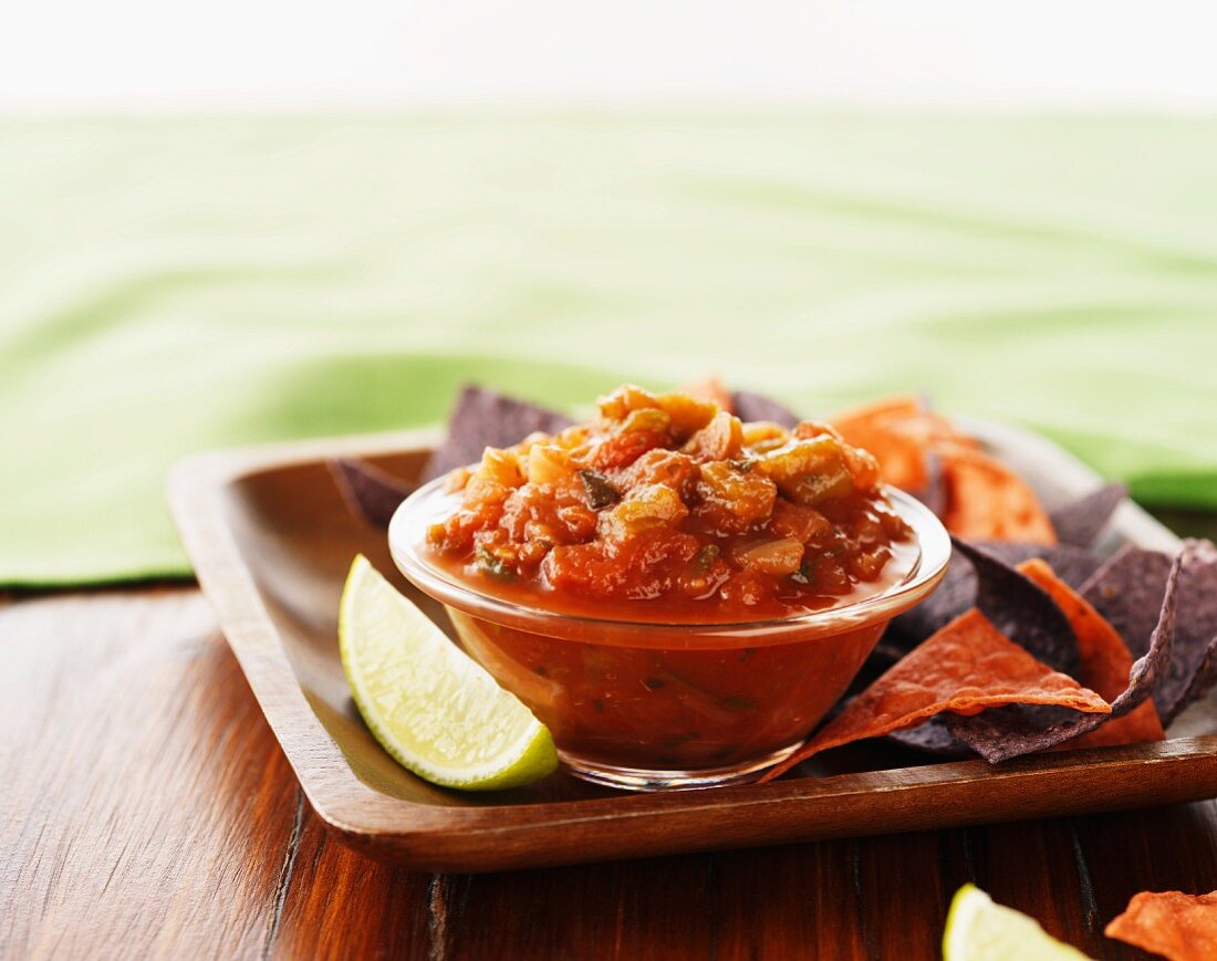 Tomato salsa and tortilla chips made from red and black corn
