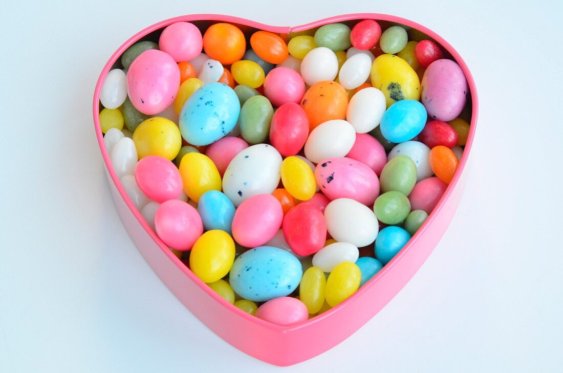 A heart-shaped tin of colourful sugar eggs