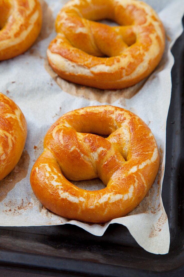 Freshly baked pretzels on the baking tray