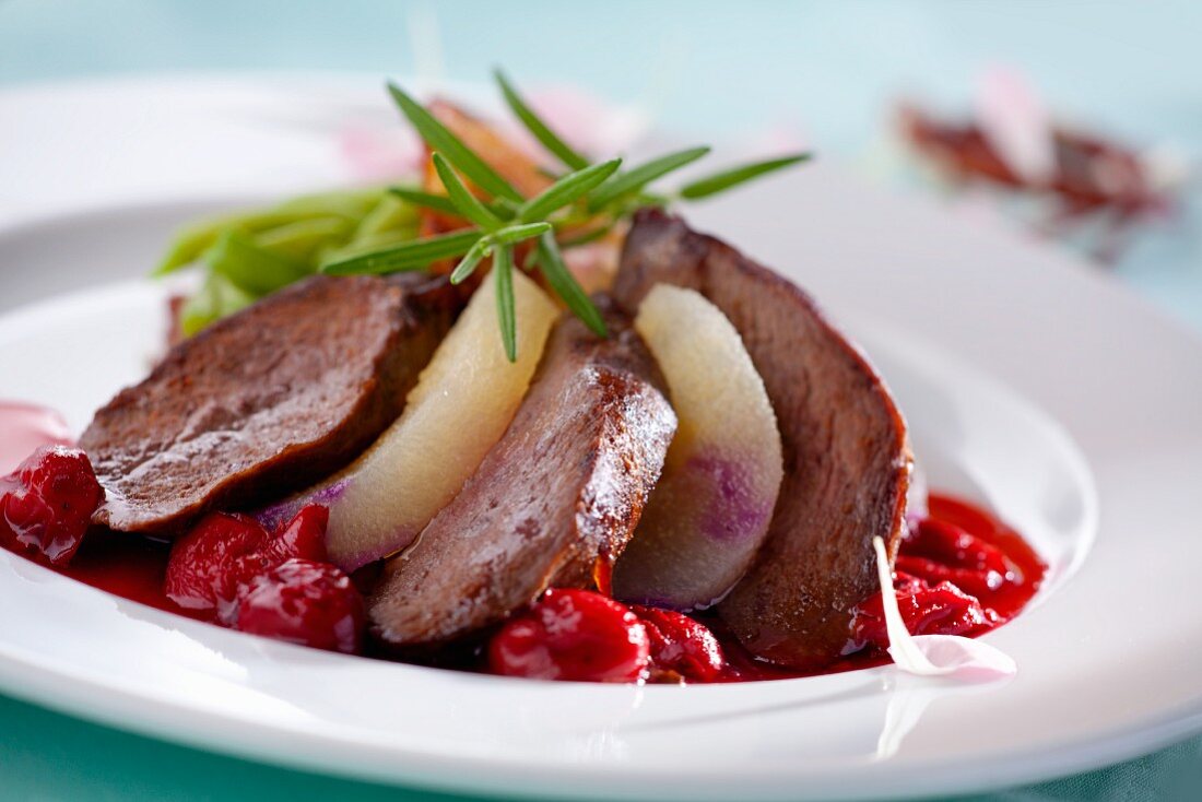 Duck breast with pears, cherries and fresh rosemary