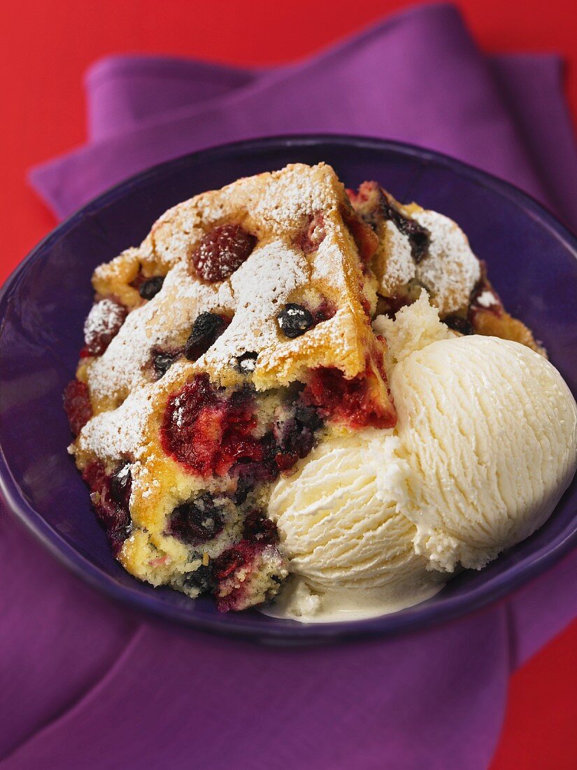 Mixed berry sponge cake with vanilla ice cream