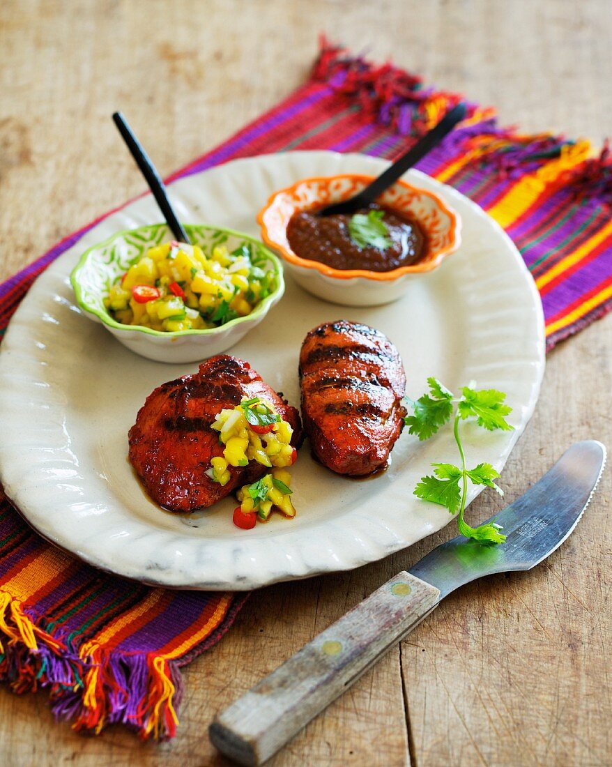 Barbecued pork medallions with two different sauces