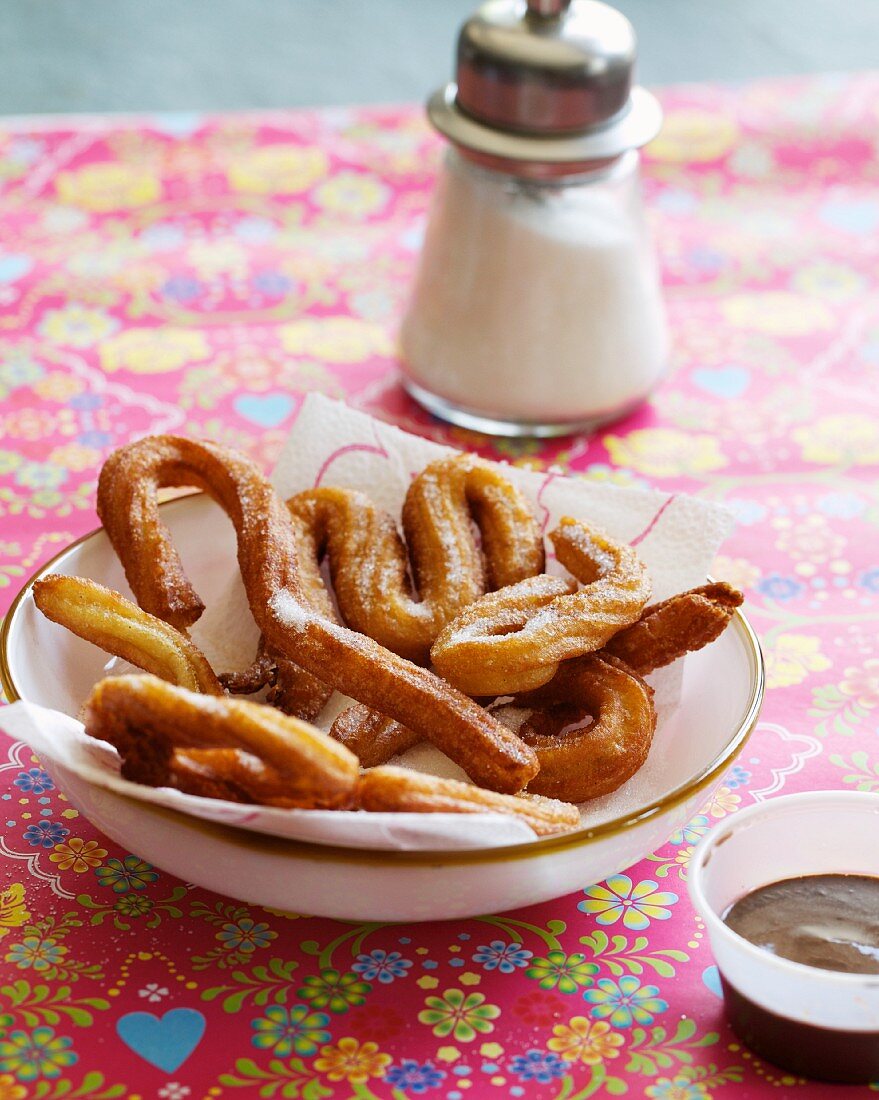 Mexican doughnuts with chocolate sauce