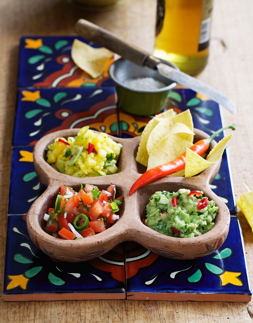 Guacamole, mango salsa and tomato salsa; served with tortilla chips
