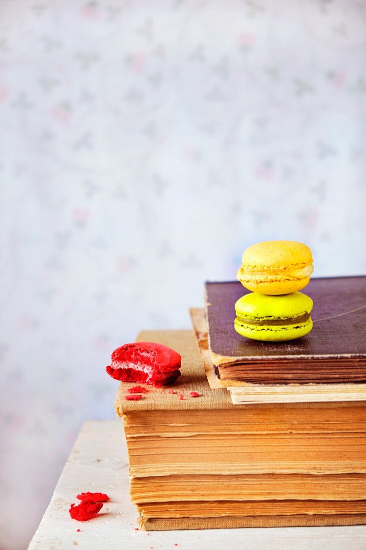 Macaroons on a pile of old books