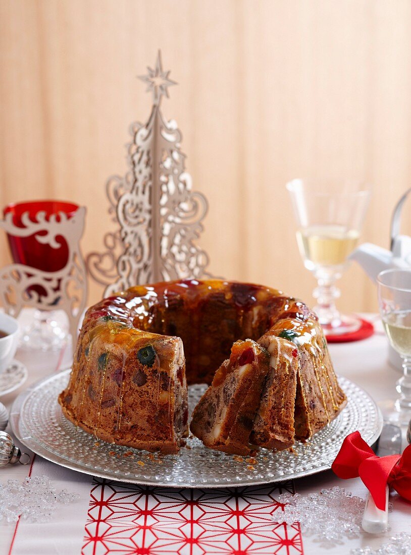 Festive fruit cake with candied fruits and caramel drizzle