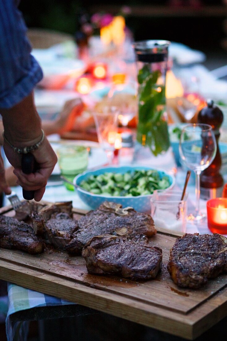 Barbecued beef steaks for a barbecue party in the garden