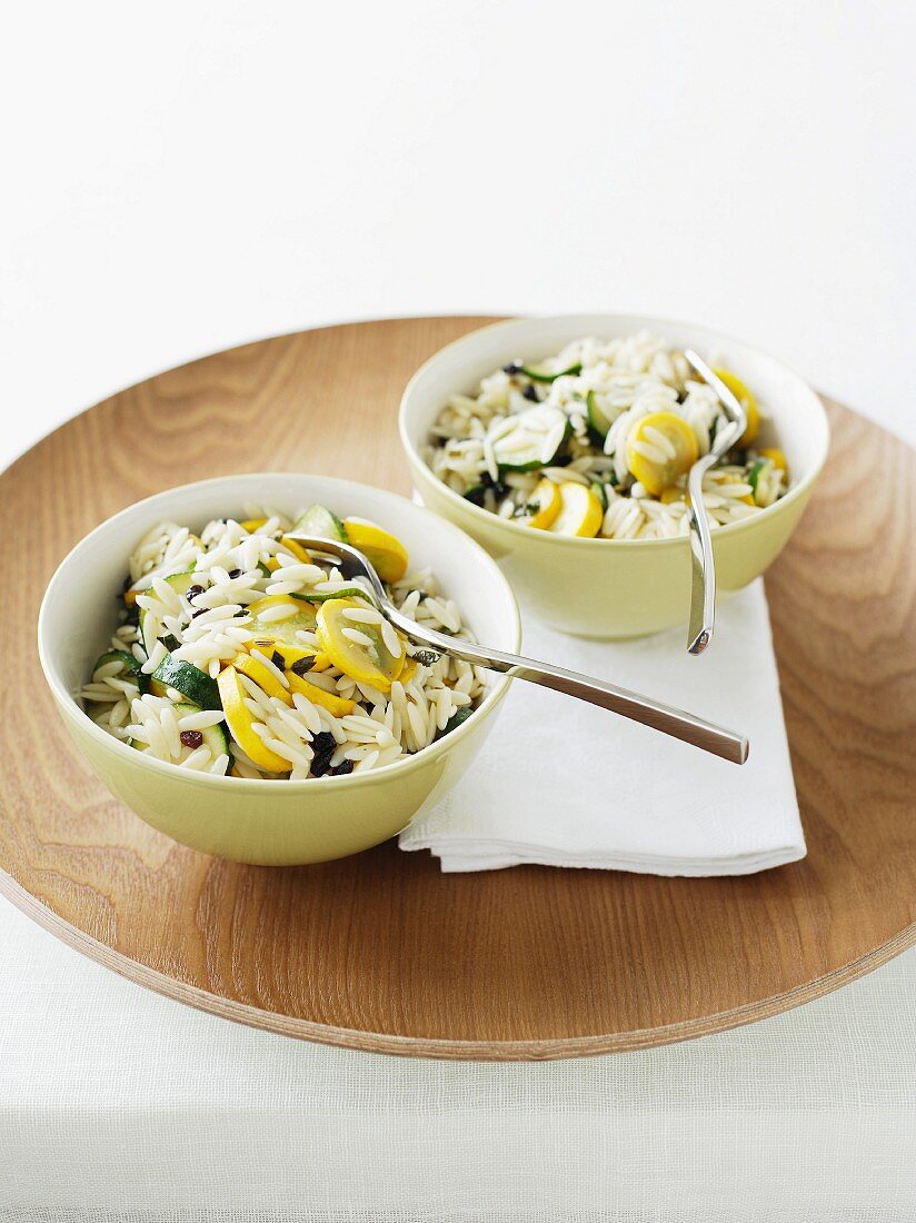 Rice with sliced yellow and green courgettes