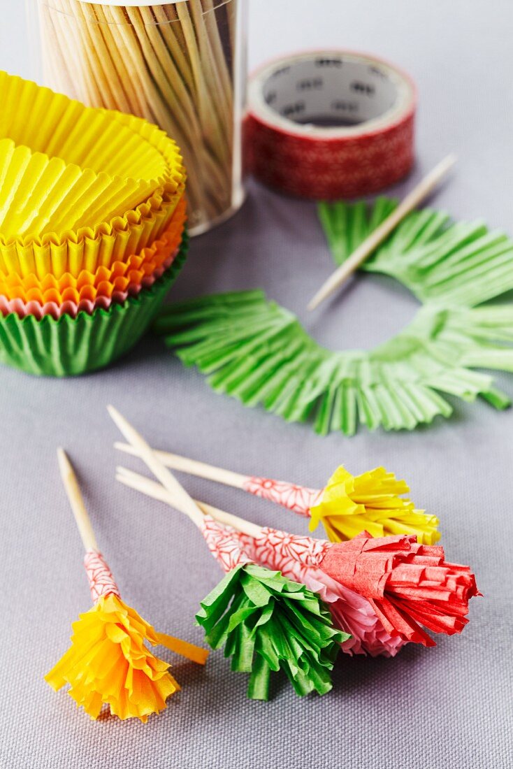 Frilly cocktail sticks made from paper cake cases