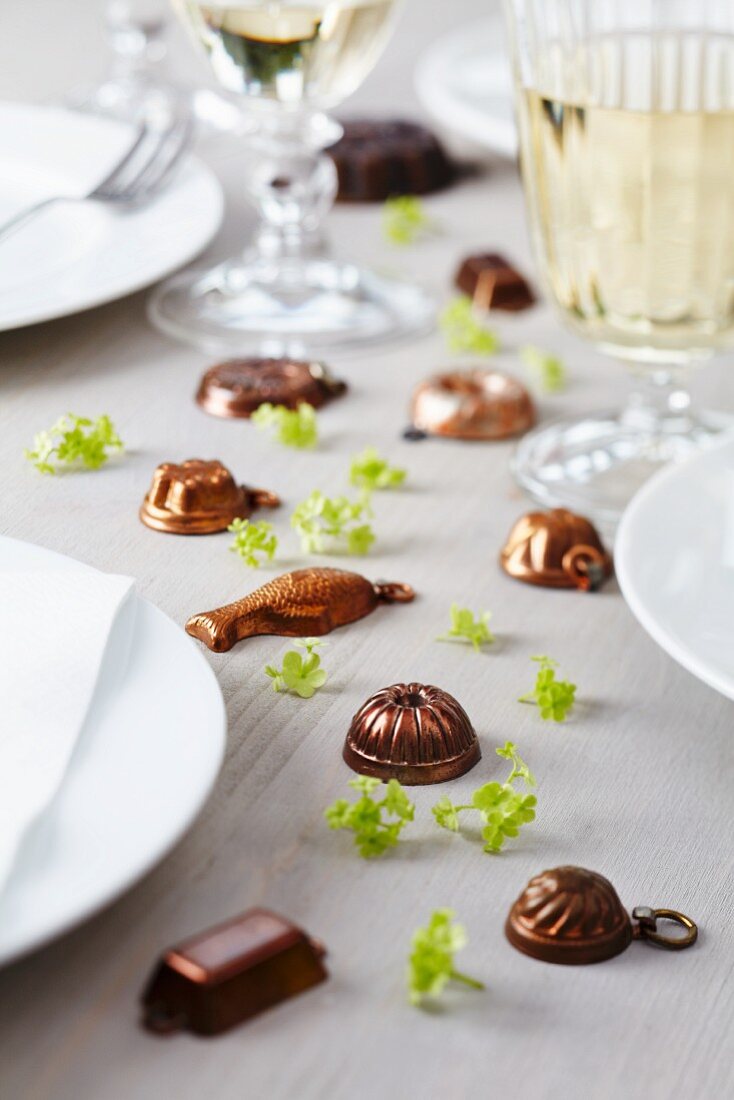 Dolls house cake moulds & viburnum florets decorating table