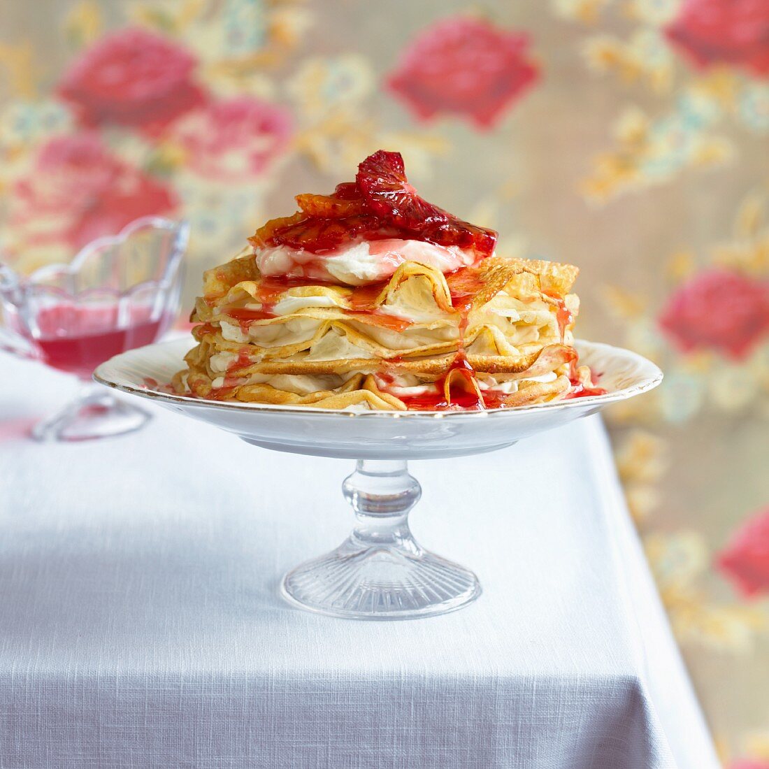 Pancakes with sweetened whipped cream and blood oranges