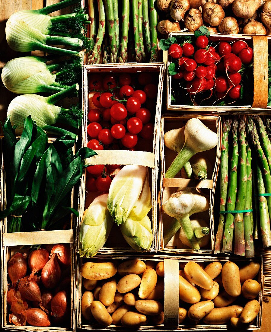 Assorted types of vegetables in woodchip baskets