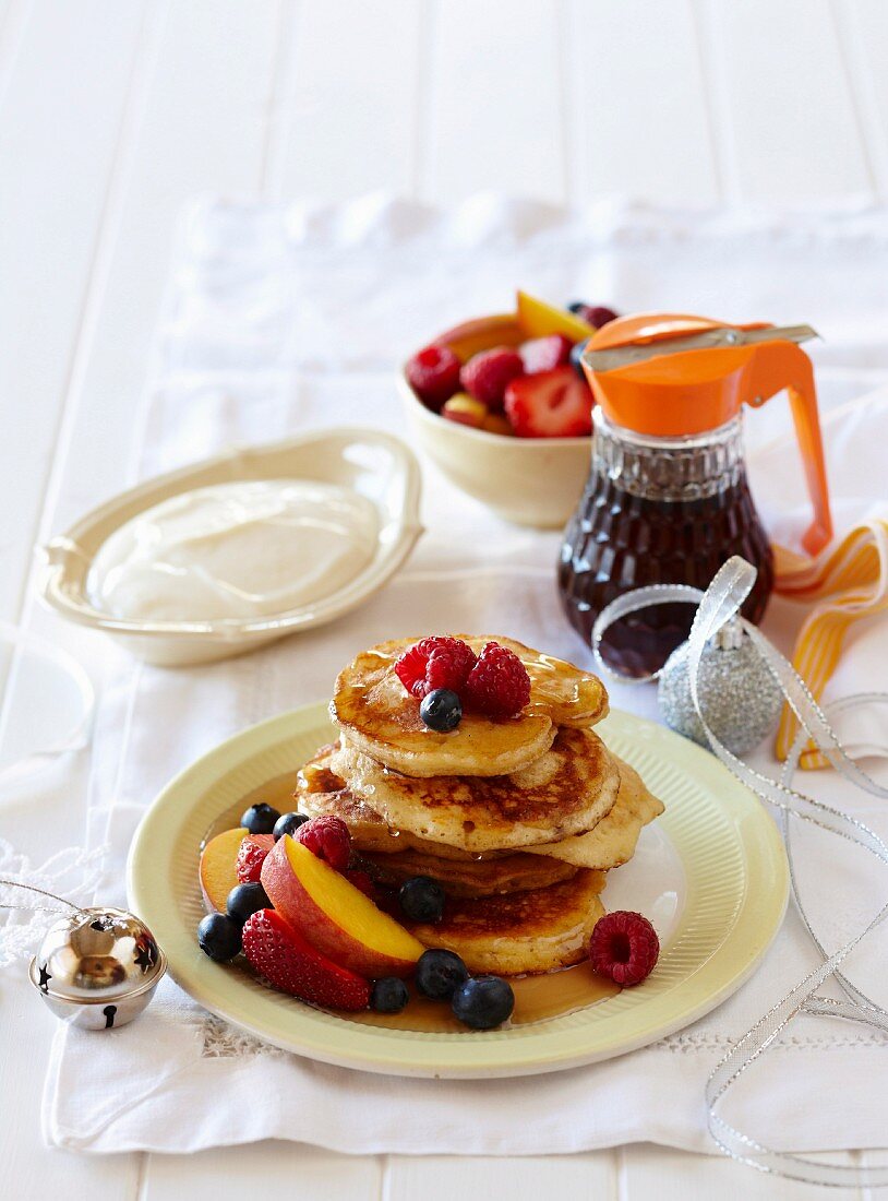 Pancakes with maple syrup and fruits