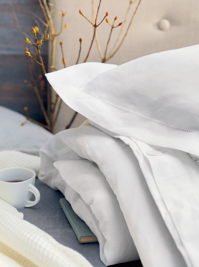 Pillows and duvet in white covers on bed