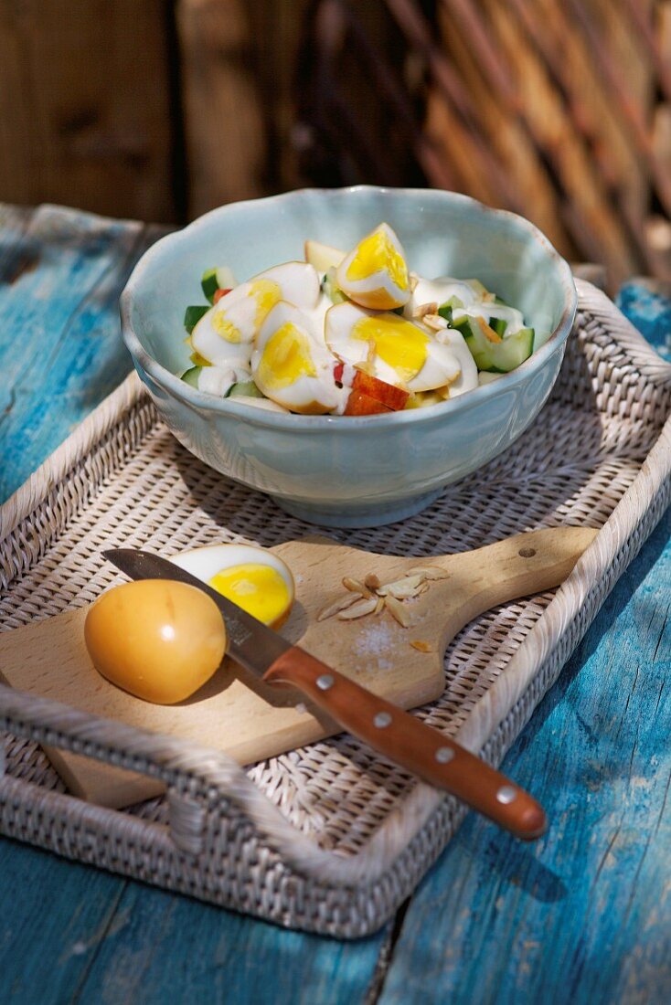 Smoked eggs on a bed of warm cucumber salad