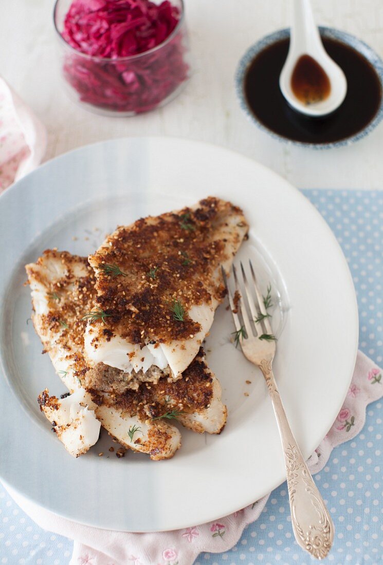 Fried orange roughy fillets with a sesame and walnut crust