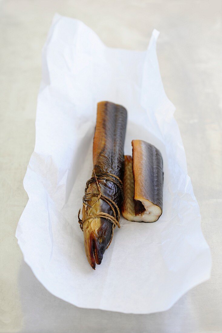 Smoked eel on white paper