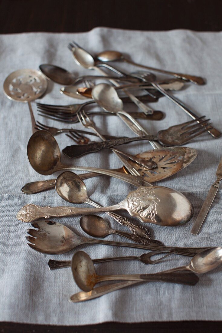 Old Spoons and Forks on Linen