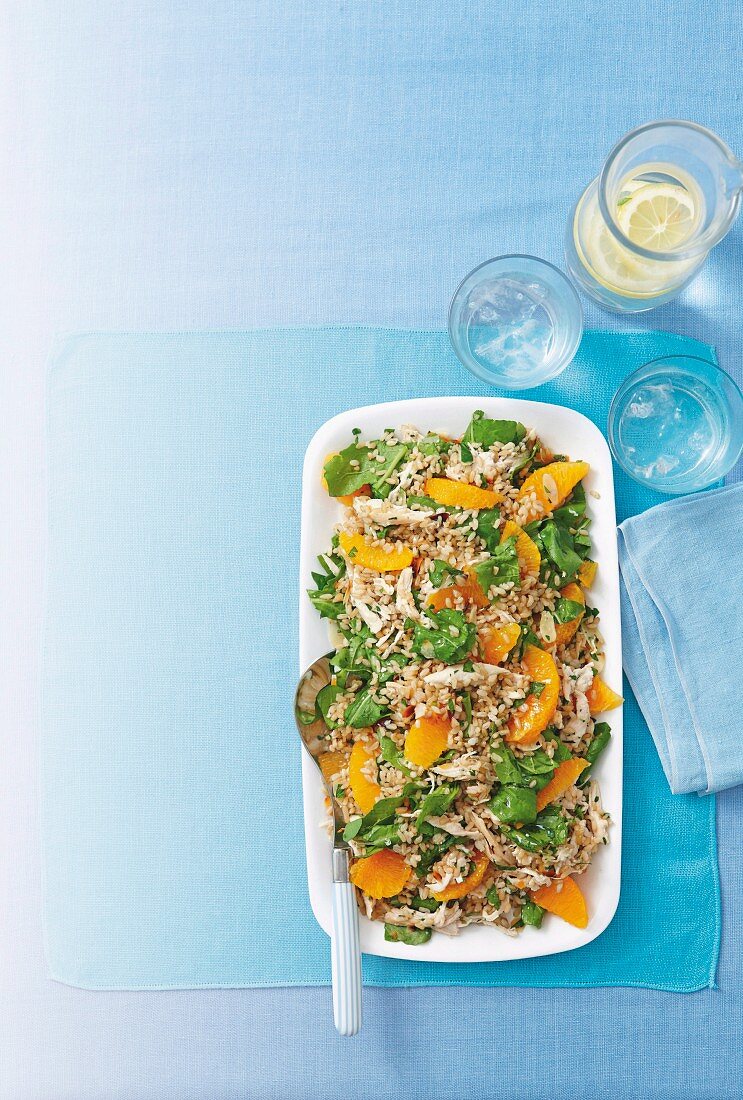 Rice salad with chicken and oranges