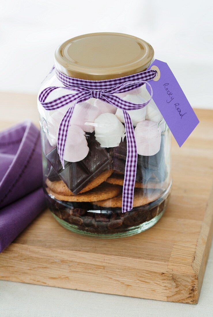 A jar containing dry ingredients for making Rocky Road (chocolate and marshmallow cake, USA)