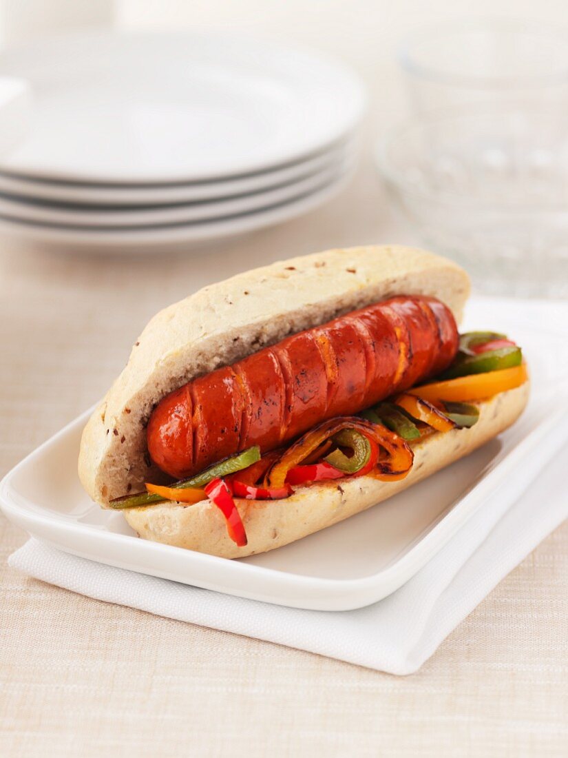 Hot dog with sliced vegetables and cheese