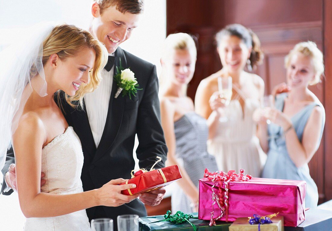 Wedding couple opening gifts