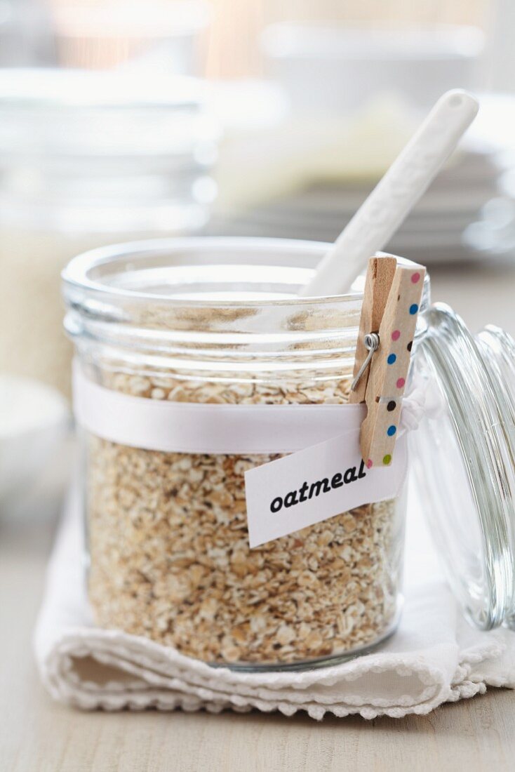 Storage jar of oatmeal & clothes peg holding label