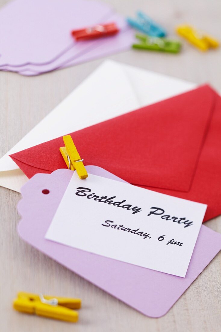 Invitation card with envelope and clothes peg