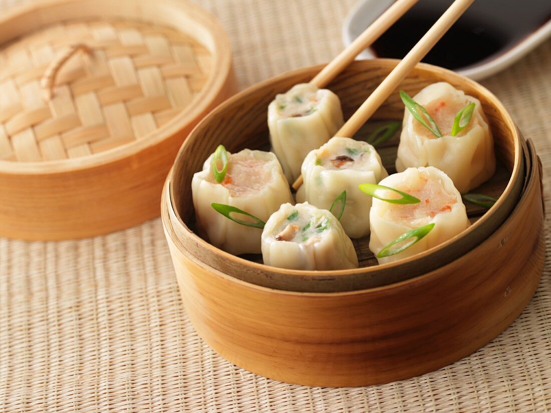 Dim sum (steamed filled dumplings, China) in a bamboo steamer