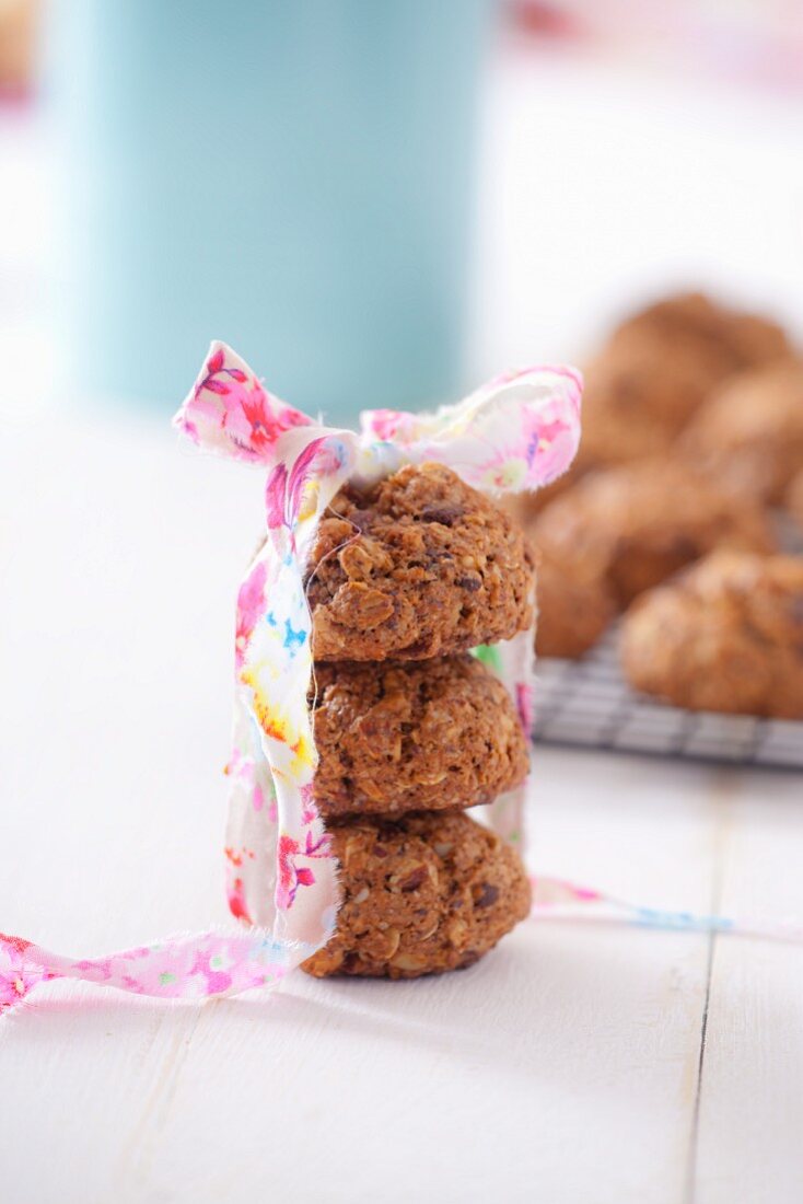 A stack of oat biscuits with a gift ribbon