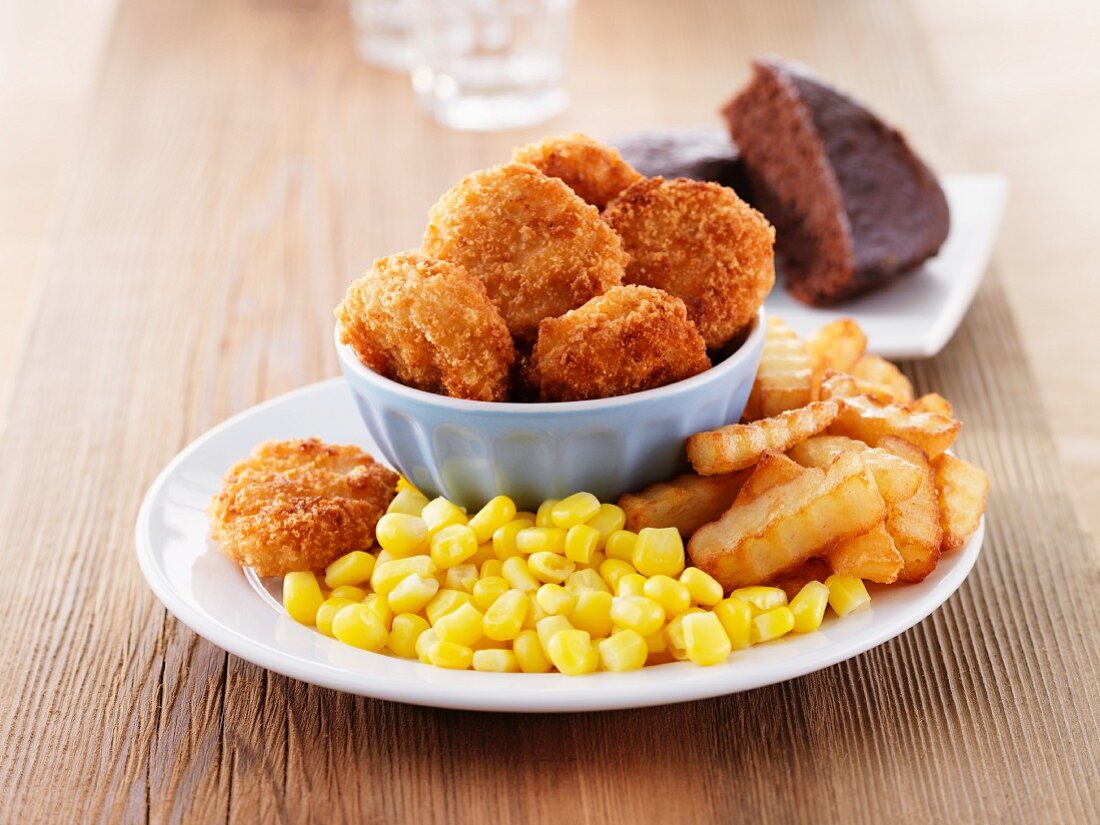 Chicken nuggets with chips and sweetcorn