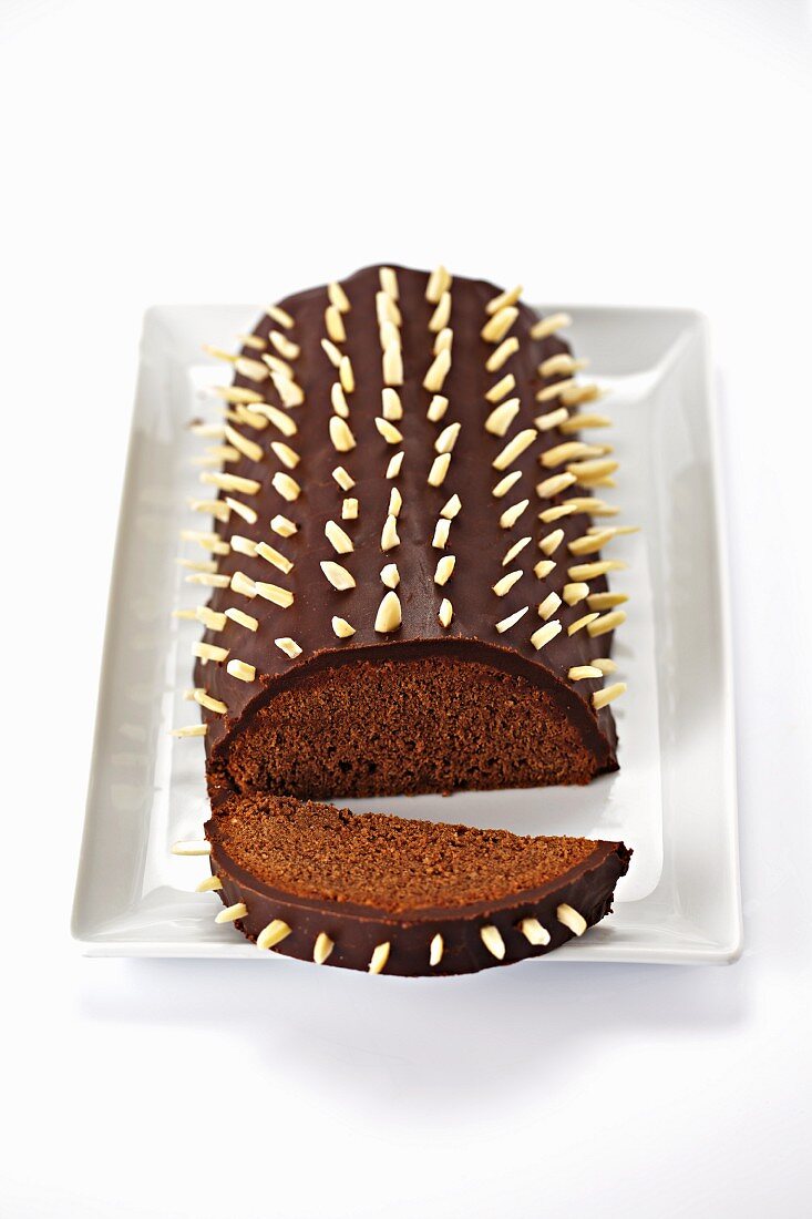 Rehrücken (cake designed to look like a saddle of venison) with chocolate icing and sliced almonds
