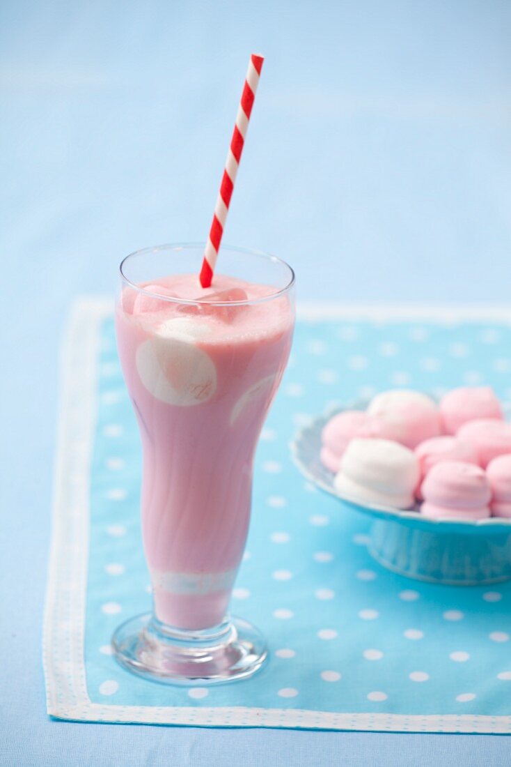 Strawberry milkshake with marshmallows in a glass