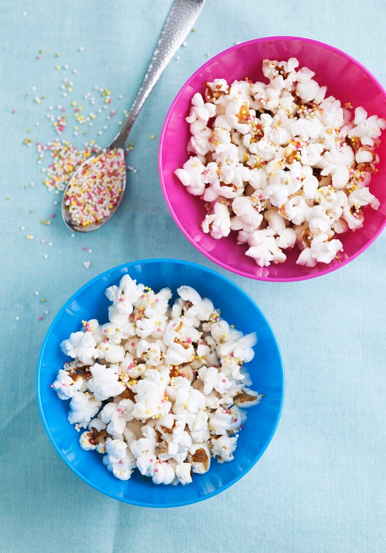 Popcorn in bowls with colourful sugar sprinkles