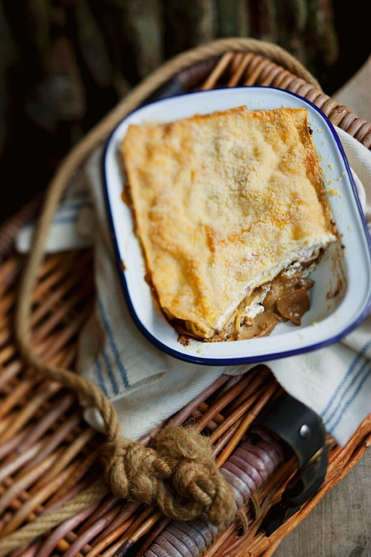 Lasagne with ham and mushrooms in the dish it was baked in