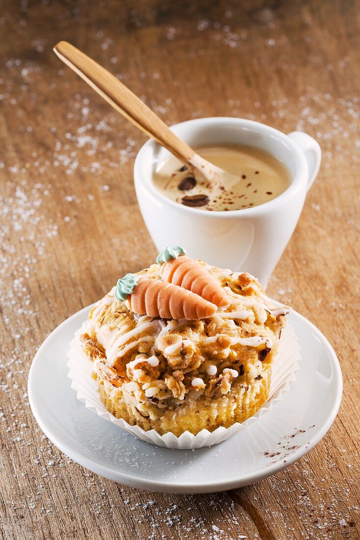 A carrot muffin with a cup of coffee