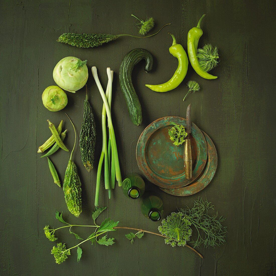 An arrangement of green vegetables and herbs